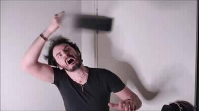 Bearded Man In Black Shirt Throwing Something GIF