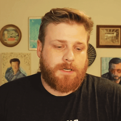 Bearded Man In Black Shirt With Letter S GIF
