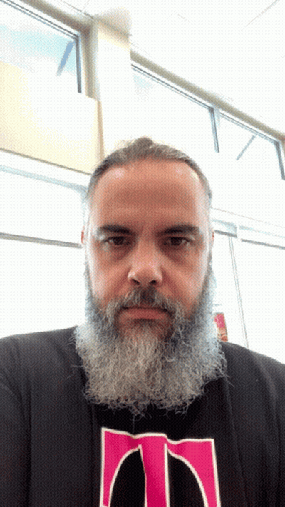 Bearded Man In Black Shirt With Pink T GIF