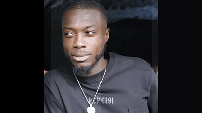 Bearded Man In Black T-Shirt And Necklace GIF