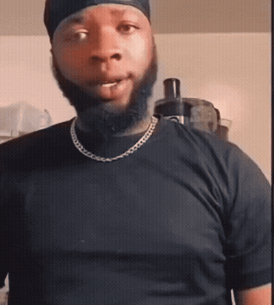 Bearded Man In Black T-Shirt With Chain GIF