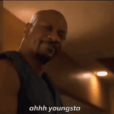 Bearded Man In Black Tank Talking GIF