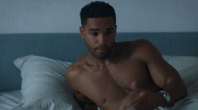 Bearded Man In Black Tank Top Eyes Closed Looking Down GIF