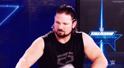 Bearded Man In Black Tank Top In Front Of Blue Screen GIF