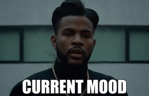 Bearded Man In Black Turtleneck With Current Mood On Face GIF