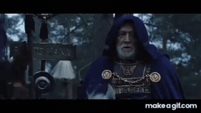 Bearded Man In Blue Cape In Snowy Woods GIF
