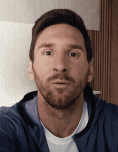 Bearded Man In Blue Jacket Looking At Camera GIF