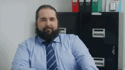 Bearded Man In Blue Shirt And Tie At Filing Cabinet GIF