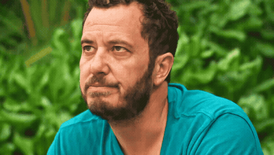 Bearded Man In Blue Shirt Looking To Side GIF