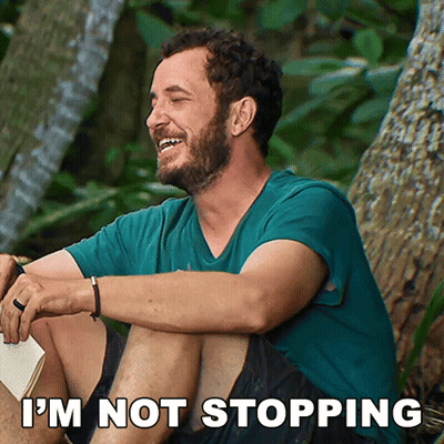 Bearded Man In Blue Shirt Looks To Side GIF
