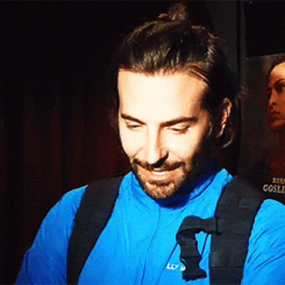 Bearded Man In Blue Shirt With Black Neck Strap GIF