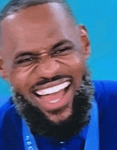 Bearded Man In Blue Shirt With Medal GIF