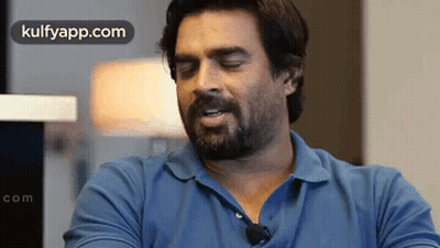 Bearded Man In Blue Shirt With Microphone GIF