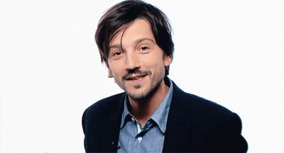 Bearded Man In Blue Striped Shirt Making Peace Sign GIF