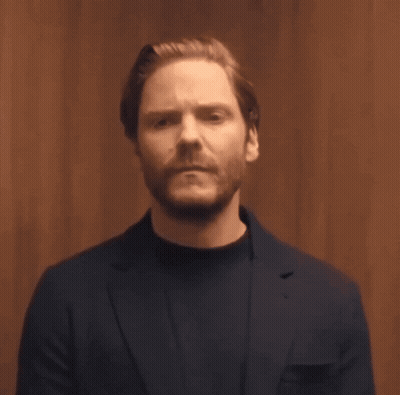 Bearded Man In Blue Suit And Black Sweater GIF