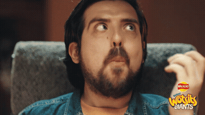 Bearded Man In Chair With Walkers Woggles Giants On Arm GIF