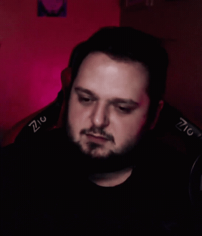 Bearded Man In Chair With Z On Back GIF