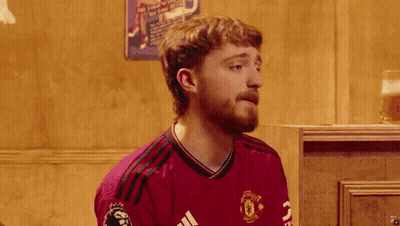 Bearded Man In Clown Wig And Maroon Shirt GIF