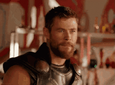 Bearded Man In Costume Looking At Camera GIF