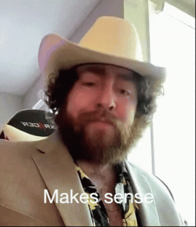 Bearded Man In Cowboy Hat And Suit Making A Face GIF