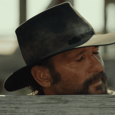 Bearded Man In Cowboy Hat Over Wooden Fence GIF