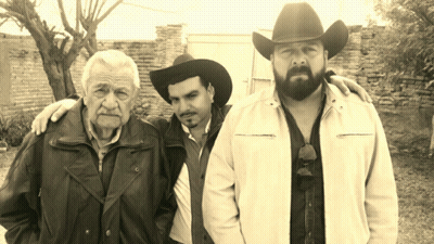 Bearded Man In Cowboy Hat With Two Men GIF