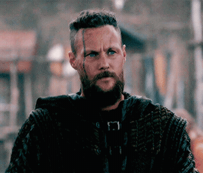 Bearded Man In Crowd Looking At Camera GIF
