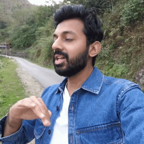 Bearded Man In Denim Jacket And White Shirt GIF
