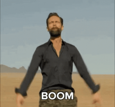 Bearded Man In Desert Arms Outstretched Chest Says Boom GIF