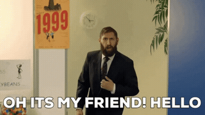 Bearded Man In Front Of 1999 Sign GIF