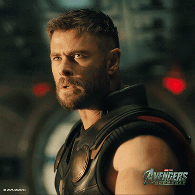 Bearded Man In Front Of Avengers Age Of Ultron Sign GIF