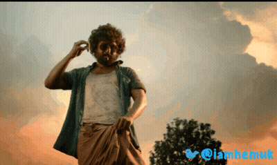 Bearded Man In Front Of Cloudy Sky And Twitter Logo GIF