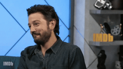 Bearded Man In Front Of IMDb Sign GIF