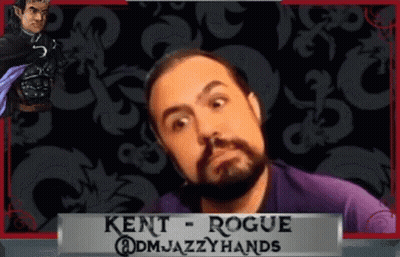 Bearded Man In Front Of Kent Rogue Banner GIF