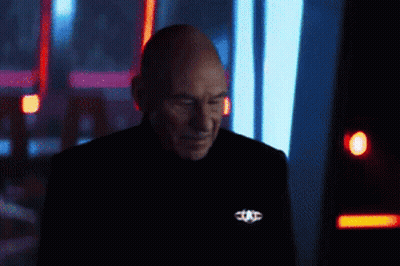 Bearded Man In Front Of Screen With T GIF