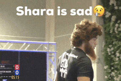 Bearded Man In Front Of Shara Is Sad Sign GIF