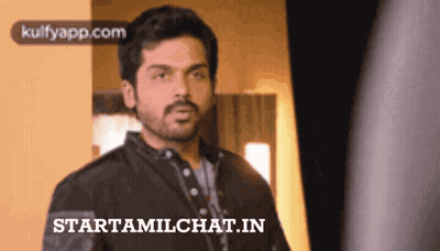 Bearded Man In Front Of Starttamilchat.in Advertisement GIF