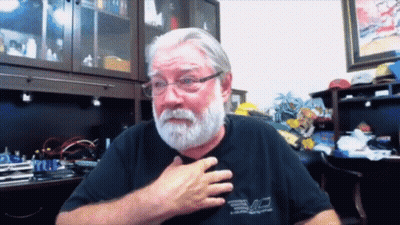 Bearded Man In Glasses And Black Evo Shirt GIF