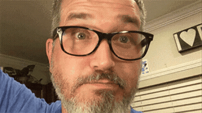 Bearded Man in Glasses and Blue Shirt