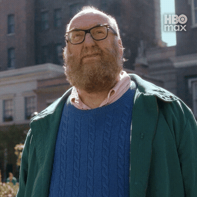 Bearded Man In Glasses And Blue Sweater Saying Maybe GIF