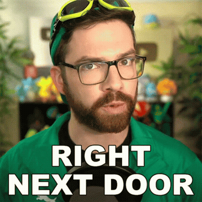 Bearded Man In Green Jacket Says Right Next Door GIF