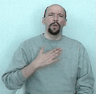 Bearded Man In Grey Sweater Making Heart Gesture GIF