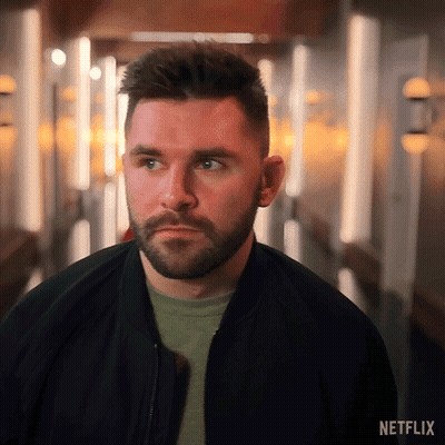 Bearded Man In Hallway With Netflix Logo GIF
