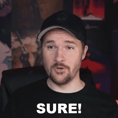 Bearded Man in Hat and Black Shirt Saying Sure