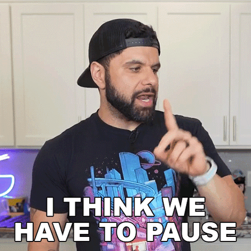 Bearded Man In Hat And Black Shirt Says I Think We Have To Pause GIF