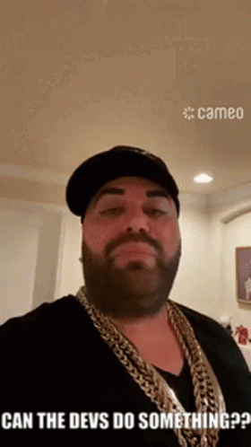 Bearded Man In Hat And Chains Saying Can The Devs Do Something GIF