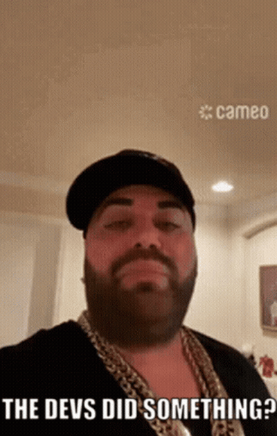 Bearded Man In Hat And Chains Says The Devs Did Something GIF