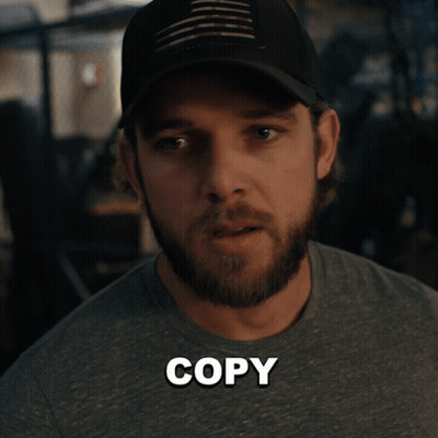 Bearded Man In Hat And Copy Shirt GIF