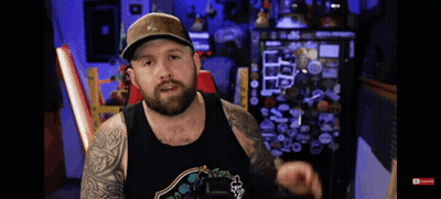 Bearded Man In Hat And Fox Tank Top GIF