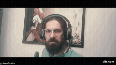 Bearded Man In Headphones And Glasses Before Painting GIF